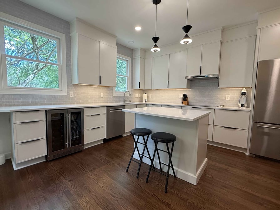 white kitchen remodel in raleigh durham with shaker cabinets and small kitchen island