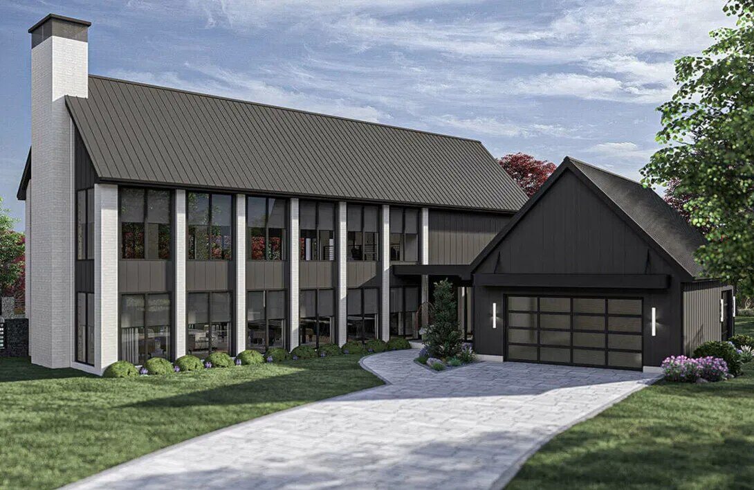 Modern barn-style home with dark exterior and large glass windows, built by Triple Crown Contractors